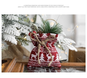 Linen Christmas gift bag with reindeer and snowflake prints and pine needle accents