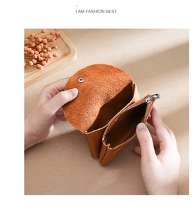 Detailed view of genuine leather wallet interior showing compartments and brown pebble texture