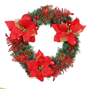 Christmas wreath 40cm with red poinsettia flowers, pine cones and berries on white backdrop