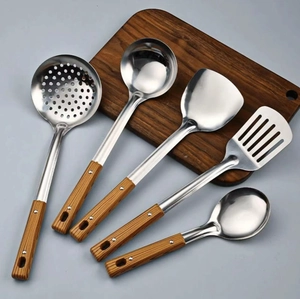 Detailed close-up of 5-piece stainless steel kitchen tool set with faux wood handles