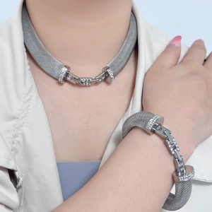 Chic silver mesh necklace and bracelet set featuring crystal-studded H-shaped links