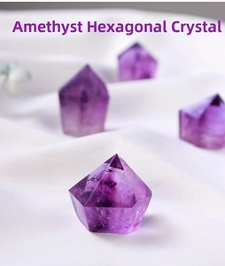 Detailed view of natural Amethyst hexagonal prism crystals with raw textures