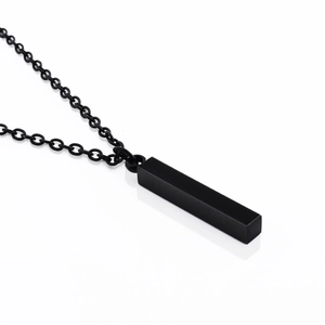 Minimalist black stainless steel bar pendant necklace with matte finish on white background