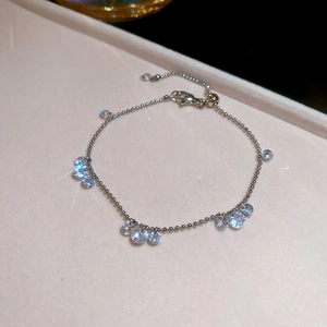 Detailed view of silver adjustable bracelet with sparkling round zircons in a jewelry box