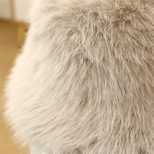 High-quality macro detail showing the soft texture of a faux fur winter hat for women.