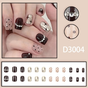 Cat eye silver mirror press-on nails with deep red-brown and star pearl accents