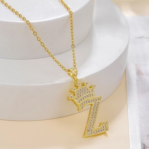 Detailed close-up of a gold-plated crown letter Z pendant with micro-set zircon stones