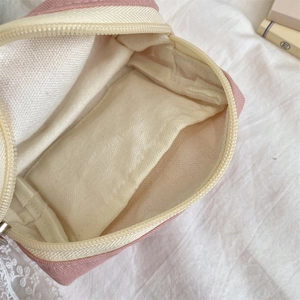Detail view of large capacity makeup bag interior showing pockets and storage space