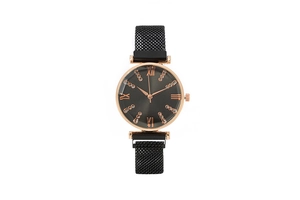 Detailed view of women's quartz watch with Roman numerals and black magnetic strap.