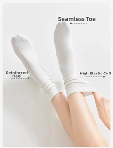Detail showing seamless toe, reinforced heel, and high elastic cuff on white cotton socks