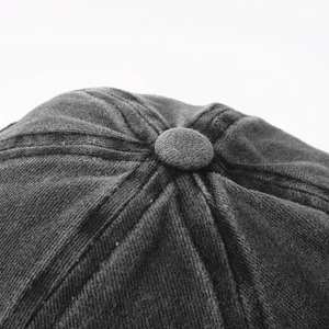 Close-up of the vintage corduroy cap top with classic stitched panels and button detail