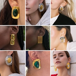 Retro oversized cat eye stone stud earrings set in gold and silver stainless steel