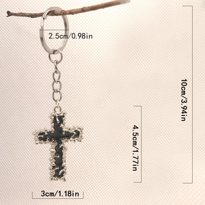 Detail view of metallic cross keychain with precise size measurements in inches and cm