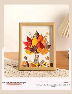 Deep 3D wooden frame with preserved autumn leaves and branches for desktop decoration