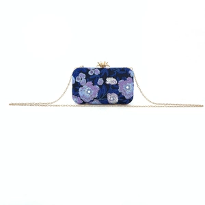 Blue floral embroidered evening bag with golden crown clasp and fine chain strap detail