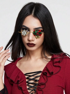 Close-up of Christmas sunglasses with snowflake and festive bow on gold metal frames