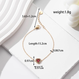 Gold stainless steel heart bracelet with red zircon inlay and lobster clasp