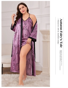 Detail view of purple satin bathrobe featuring black trim and romantic heart print
