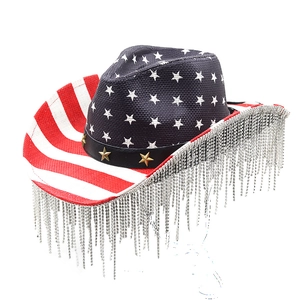 Detail of USA flag themed cowboy hat with silver rhinestone fringe and star studs