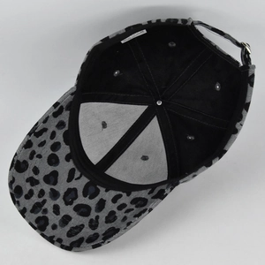 Macro shot of leopard print corduroy baseball cap interior showing cotton lining and visor