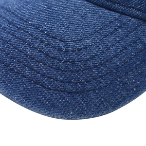 Close-up of navy blue denim baseball cap brim with precise multi-row stitching detail