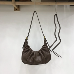 Dark brown pleated cloud shoulder bag with soft leather texture and long strap