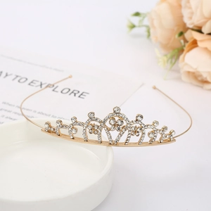Elegant gold bridal crown with sparkling rhinestones for wedding hair and cake decor