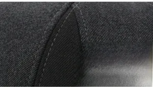 Macro shot of gray wool fabric featuring professional double-stitched sewing details