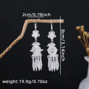 Detail showing dimensions of ethnic silver fringe earrings with flower pattern
