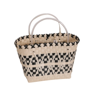 Retro handmade straw tote bag with black and white woven pattern and round handles