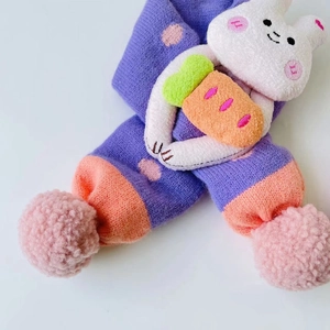 Purple knitted scarf for kids with cute bunny detail and pink pom-poms for winter warmth