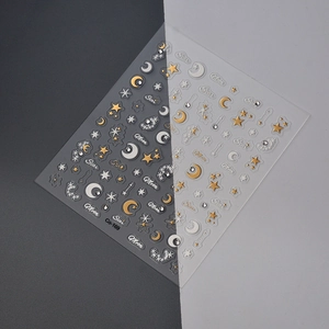 Star and moon nail art decals with gold and white embossed stars and crescent shapes
