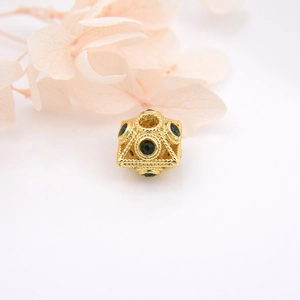Vintage hollow gold-plated sphere bead with woven texture and green zircon inlays
