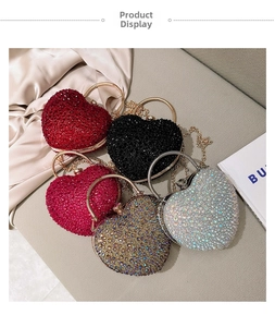 Top view of five heart-shaped evening bags with crystals and metal ring handles