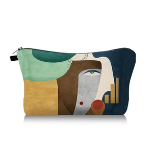 Close-up of abstract face art print on durable canvas makeup bag with black zipper