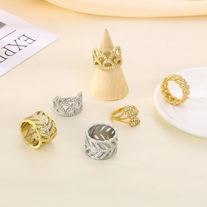 Close-up of a six-piece hollow leaf and crown ring set with embedded zircons