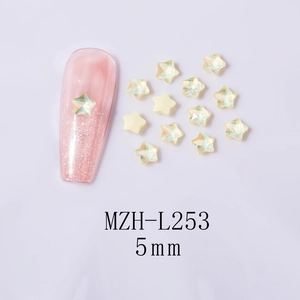 5mm star-shaped iridescent aurora nail art rhinestones on pink glitter sample nail