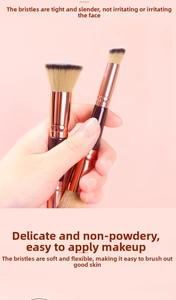 Detailed view of dual-ended makeup brush with soft bristles and rose gold ferrule