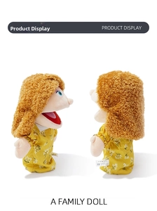 Detail of female hand puppet with brown curly hair and yellow floral dress for role play