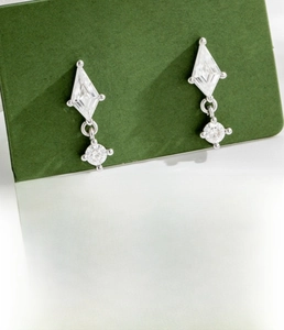 Detailed view of silver kite-shaped zircon ear studs with screw back and size specs