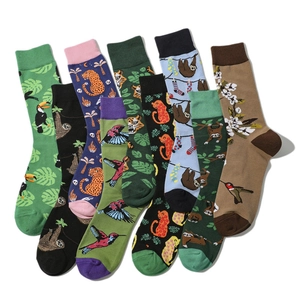 Collection of colorful cartoon animal crew socks featuring toucans sloths and tigers