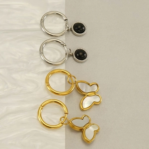Minimalist stainless steel earrings set with butterfly charm and black bead detailing