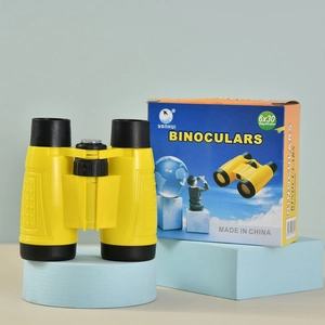 Yellow 6x30 children's toy binoculars with colorful packaging for outdoor exploration