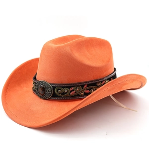 Macro detail of orange suede cowboy hat with floral embroidery and bronze gemstone buckle