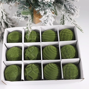 Close-up of 12 green flocked Christmas ornaments with diverse textures and festive decor