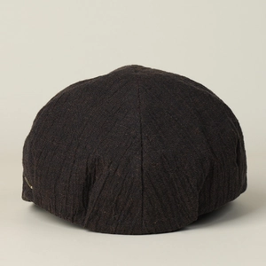 Detailed back view of dark coffee linen newsboy cap showing rich woven fabric texture