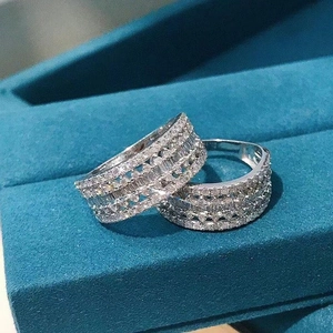 Elegant silver-plated hollow rings with multi-layer pave-set diamonds on velvet background