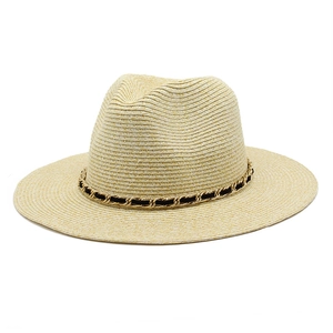 Light beige straw fedora hat featuring a stylish black and gold metal chain band