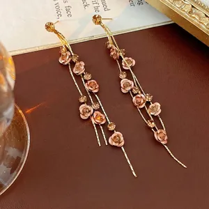 Elegant gold rose tassel earrings with champagne crystal drops and stainless steel pins