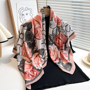Detailed close-up of realistic rose flower print on silk texture square scarf